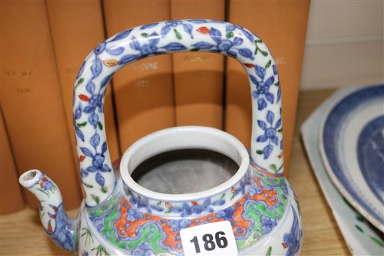 Two Chinese teapots and a cup and saucer Tallest teapot 23cm